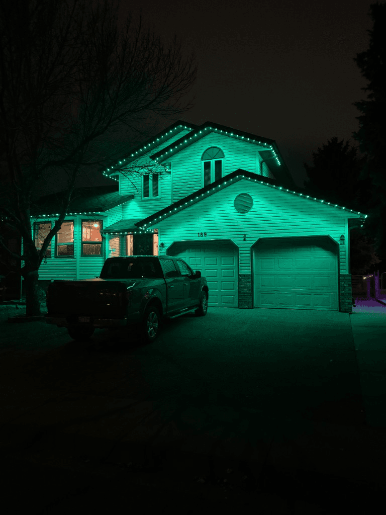 Permanent LED lights installed along a Calgary home roofline