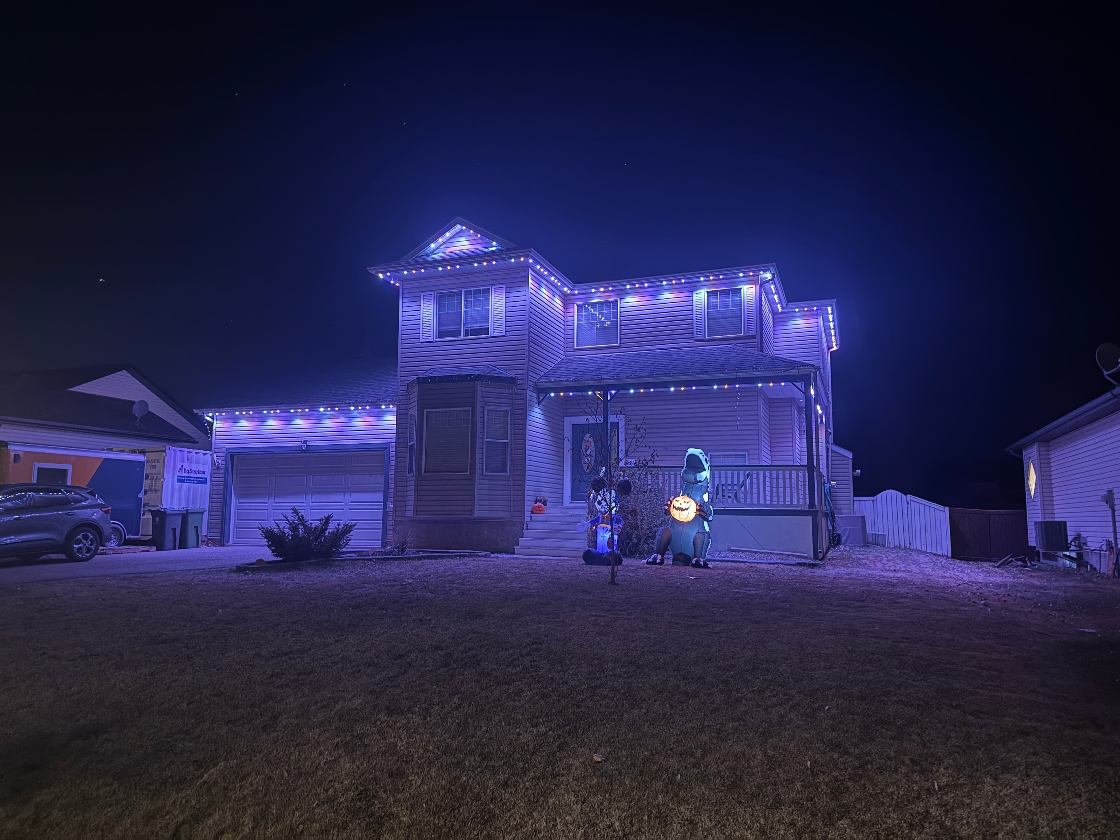 Colourful permanent LED lights on a home at night