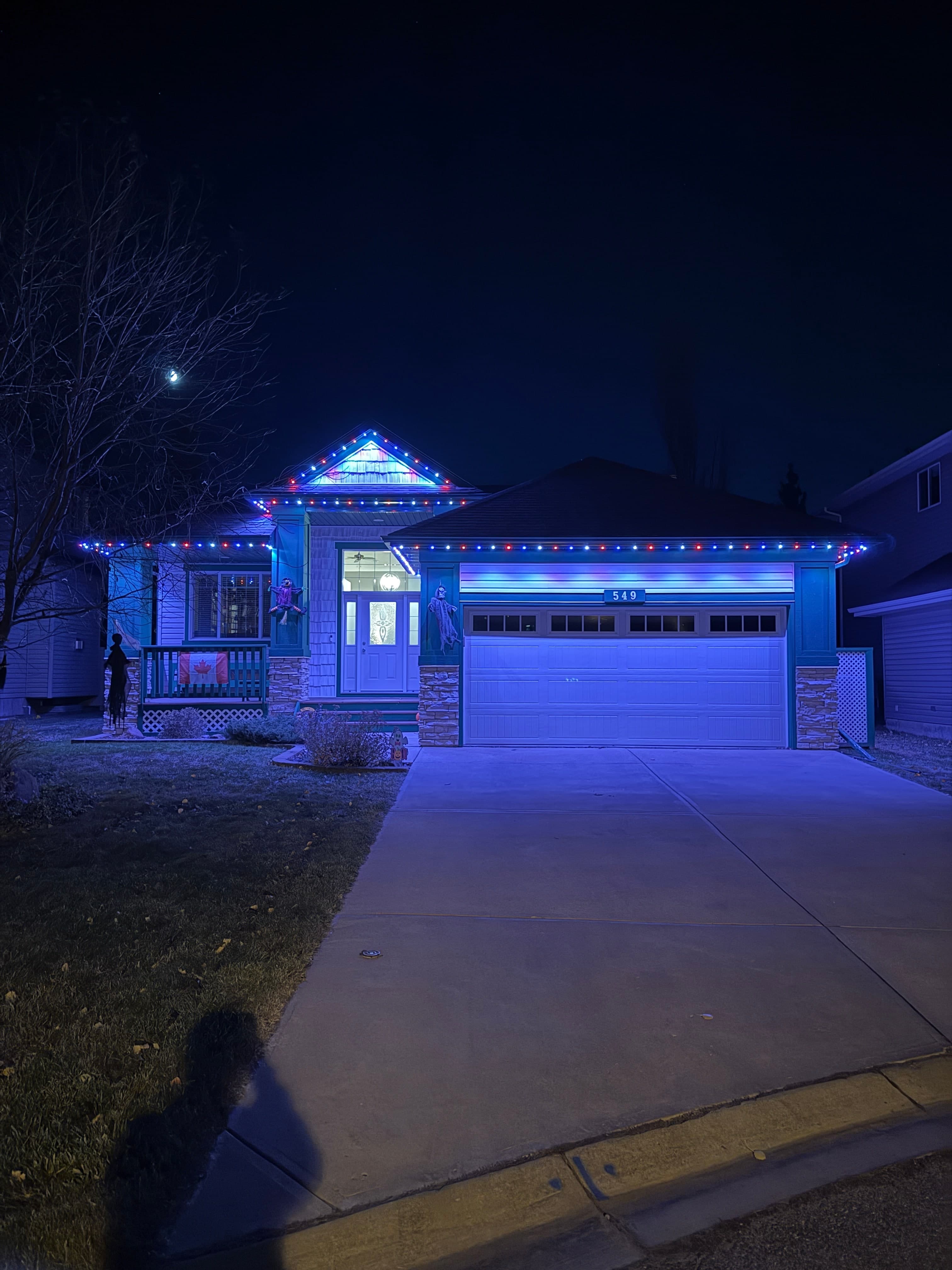 Permanent LED lights on a Calgary home at dusk