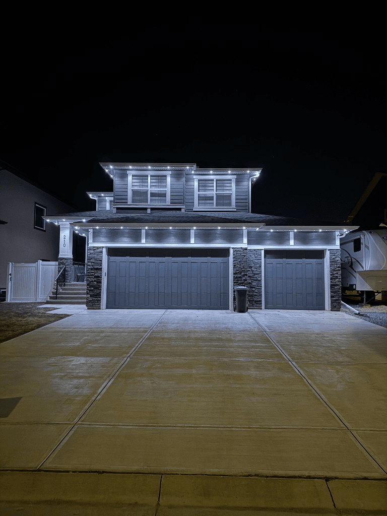 Security LED lighting on a residential soffit providing bright white illumination at night