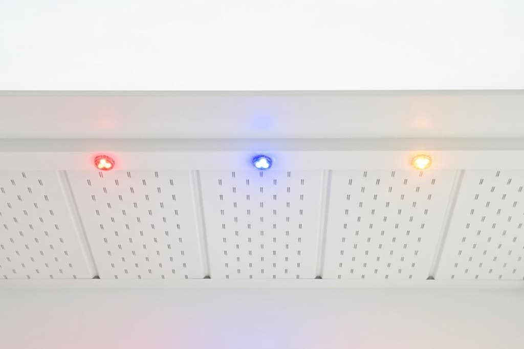 Discreet below-fascia installation with colour-matched track and LED pucks on soffit