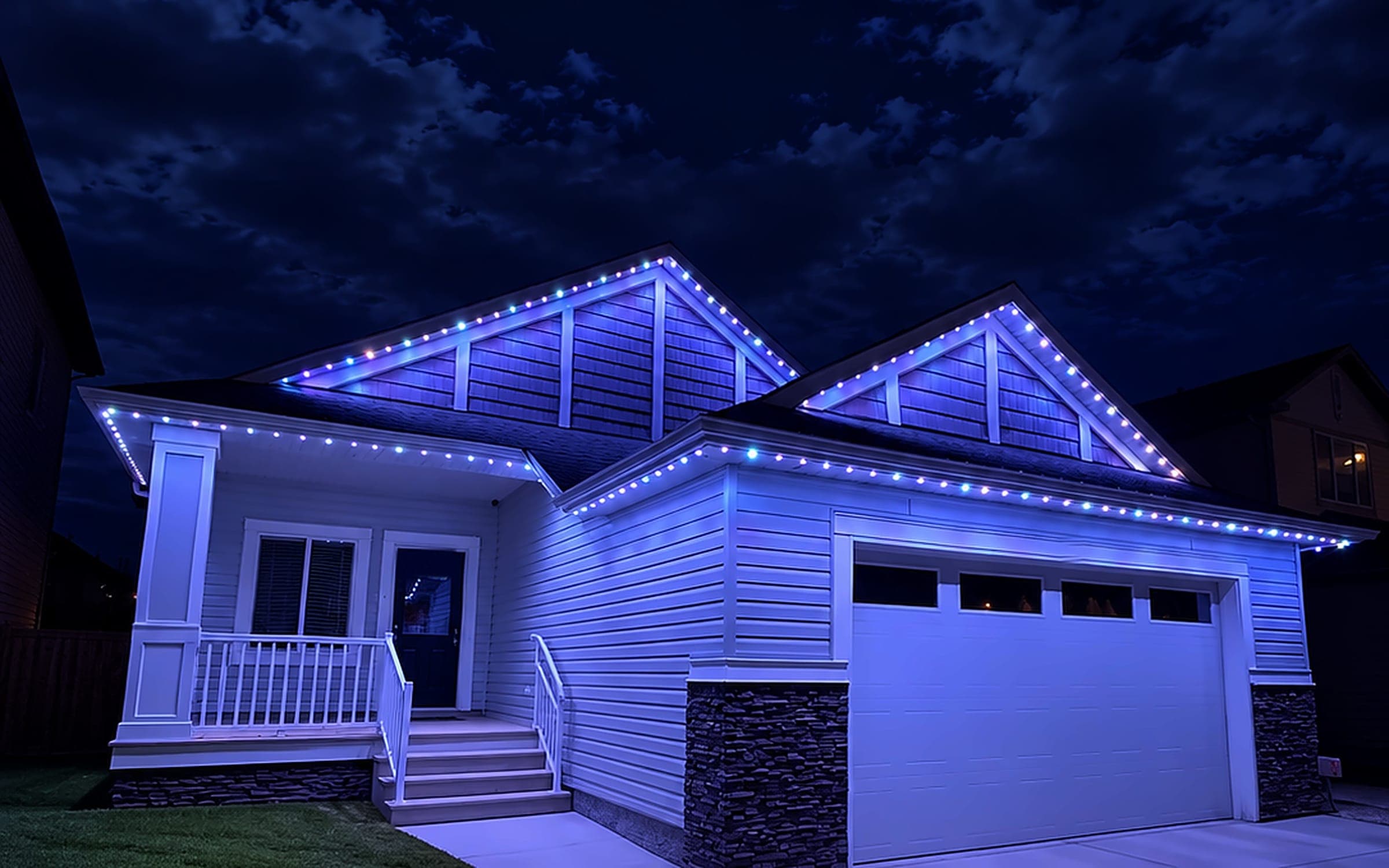 Home lit blue with permanent architectural lighting