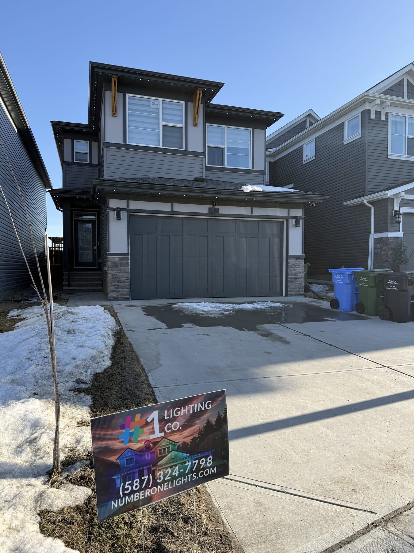 Permanent LED track installed along the rooflines of a Calgary home, nearly invisible in daylight