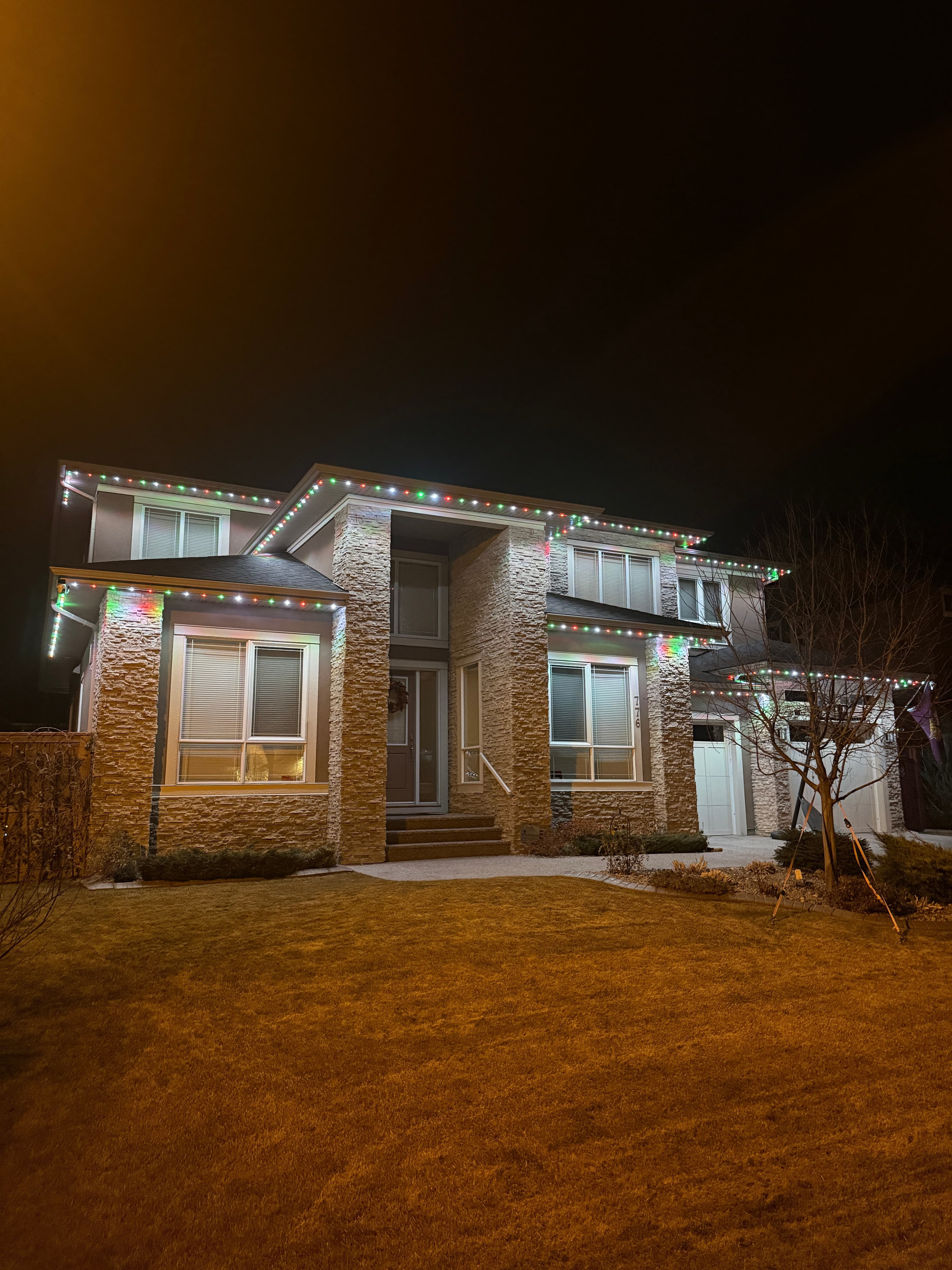 Permanent outdoor LED lighting on a home in winter conditions